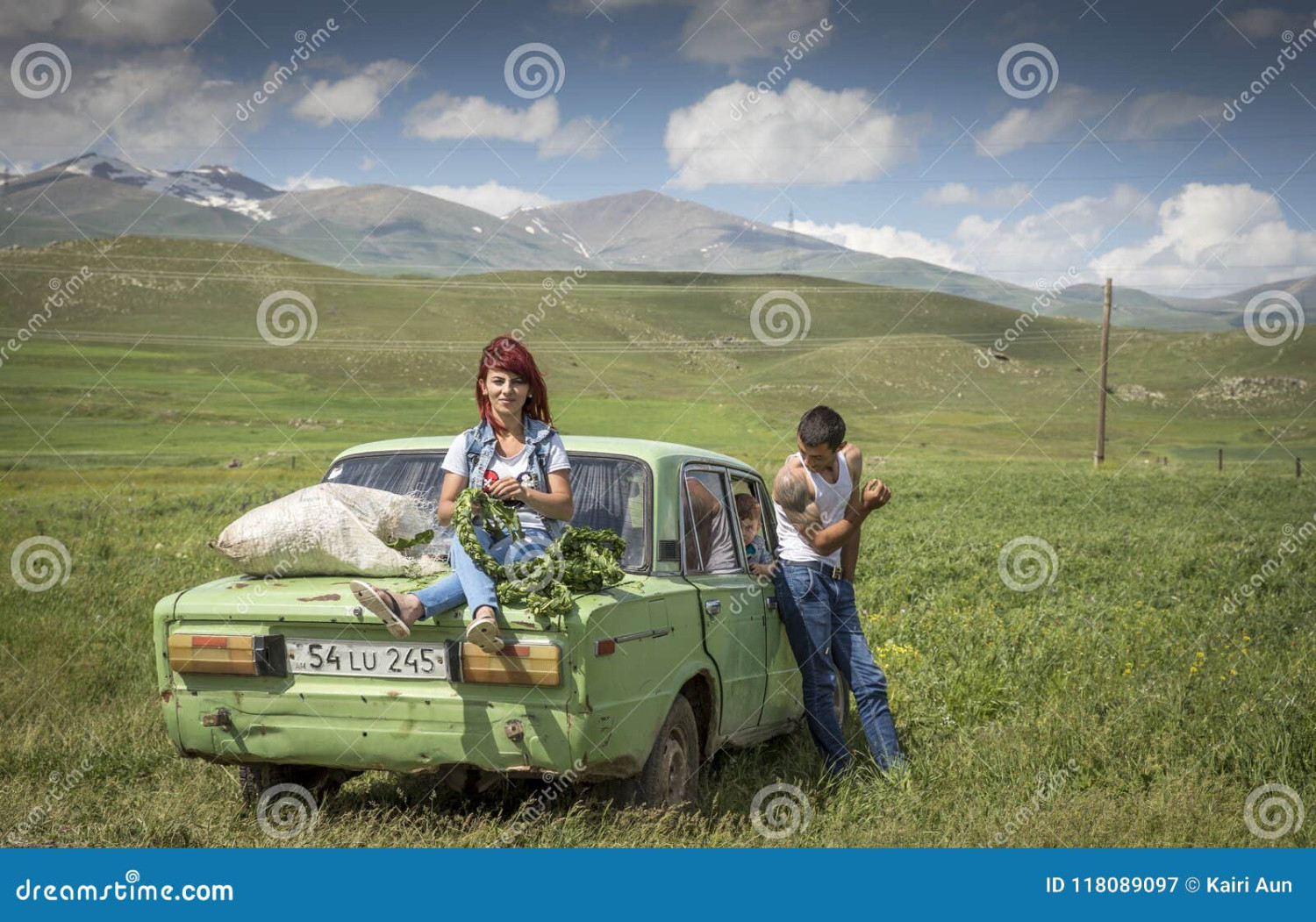 areni-armenia-st-june-family-their-car-raodside-collecting-herbs-winter-family-their-car-countryside-118089097.jpg